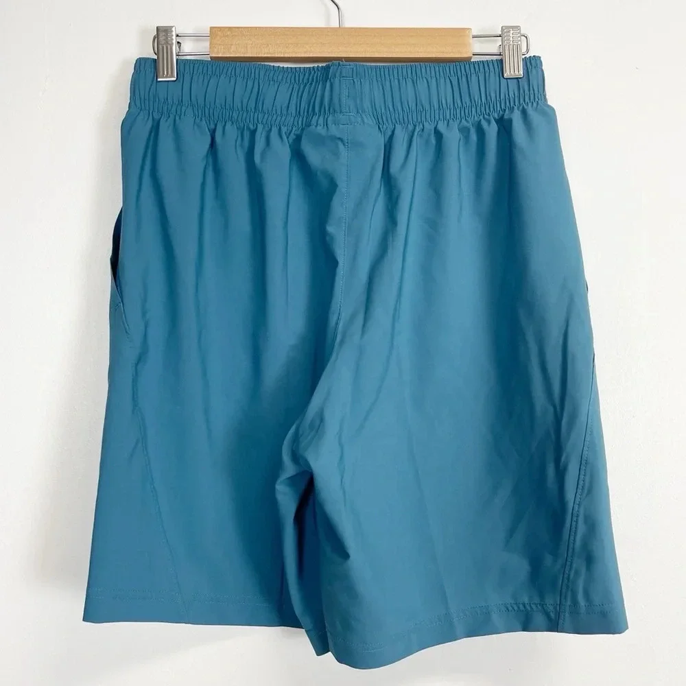 NEW Under Armour Shorts Mens Medium Blue Logo Loose Tech Woven Graphic NWOT